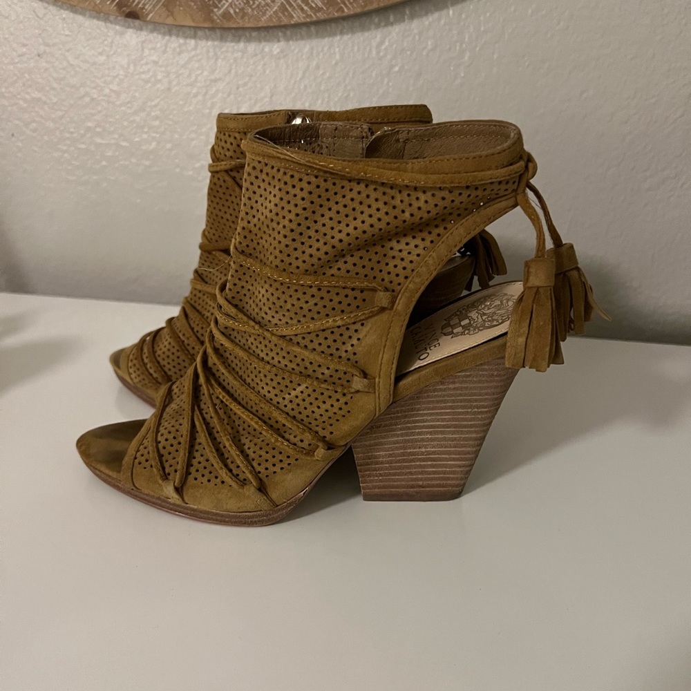 Suede mustard color peep-toe heels.